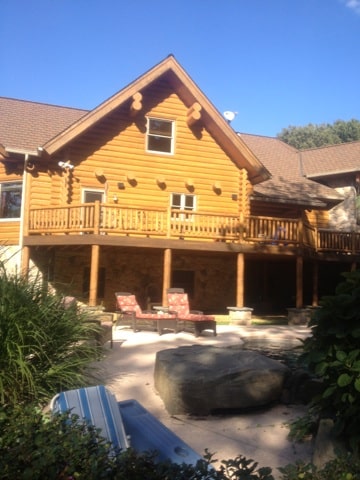 large log cabin with patio underneath