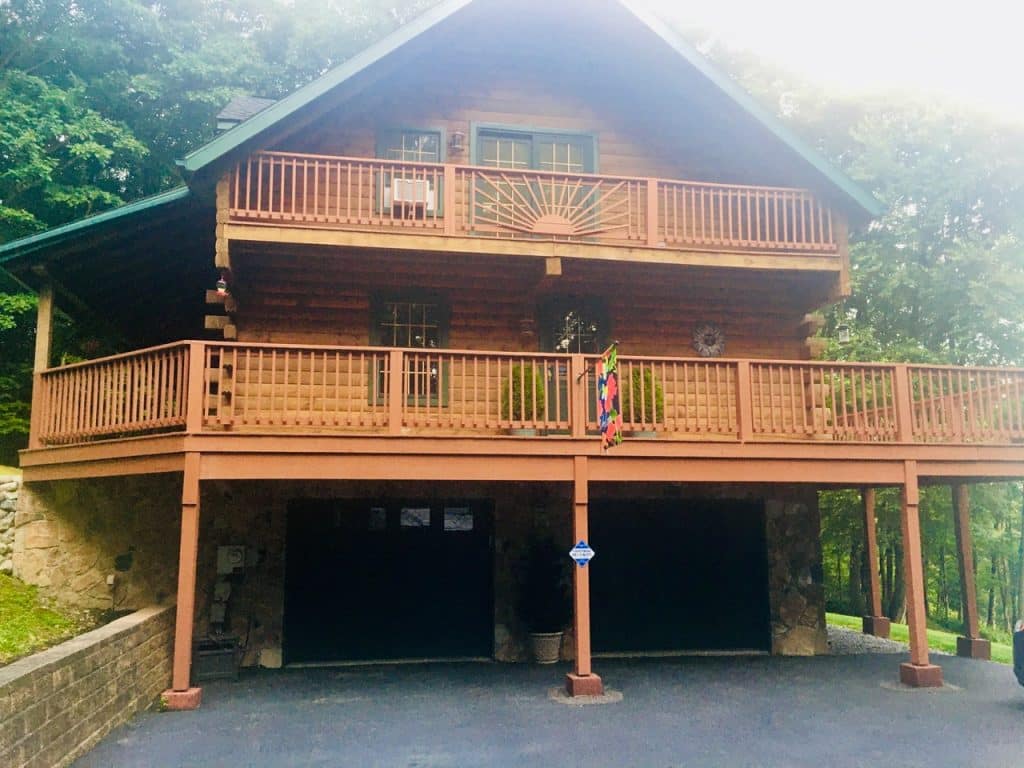 Log Chinking in Pennsylvania 1 Large wooden log home in a bright day